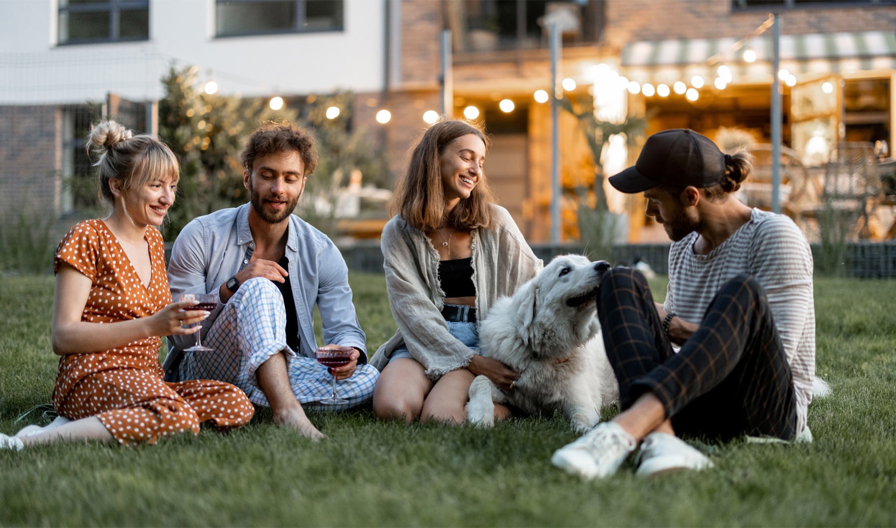 Arbor Crossing friends sitting in the grass